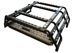 A black iron cargo rack designed for mounting on the bed of a pickup truck, featuring a modular and adjustable design with a mesh base.
