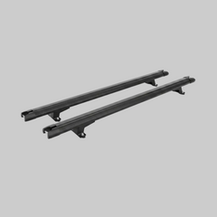 Pair of black Ironhaul canopy cross bars with mounting feet on a light neutral background