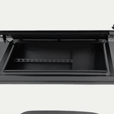 Open black IRONHAUL truck canopy tool box with divided storage compartments