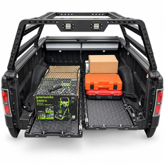 IRONHAUL two-piece slide-out cargo trays extended from a pickup bed with secured tools and boxes