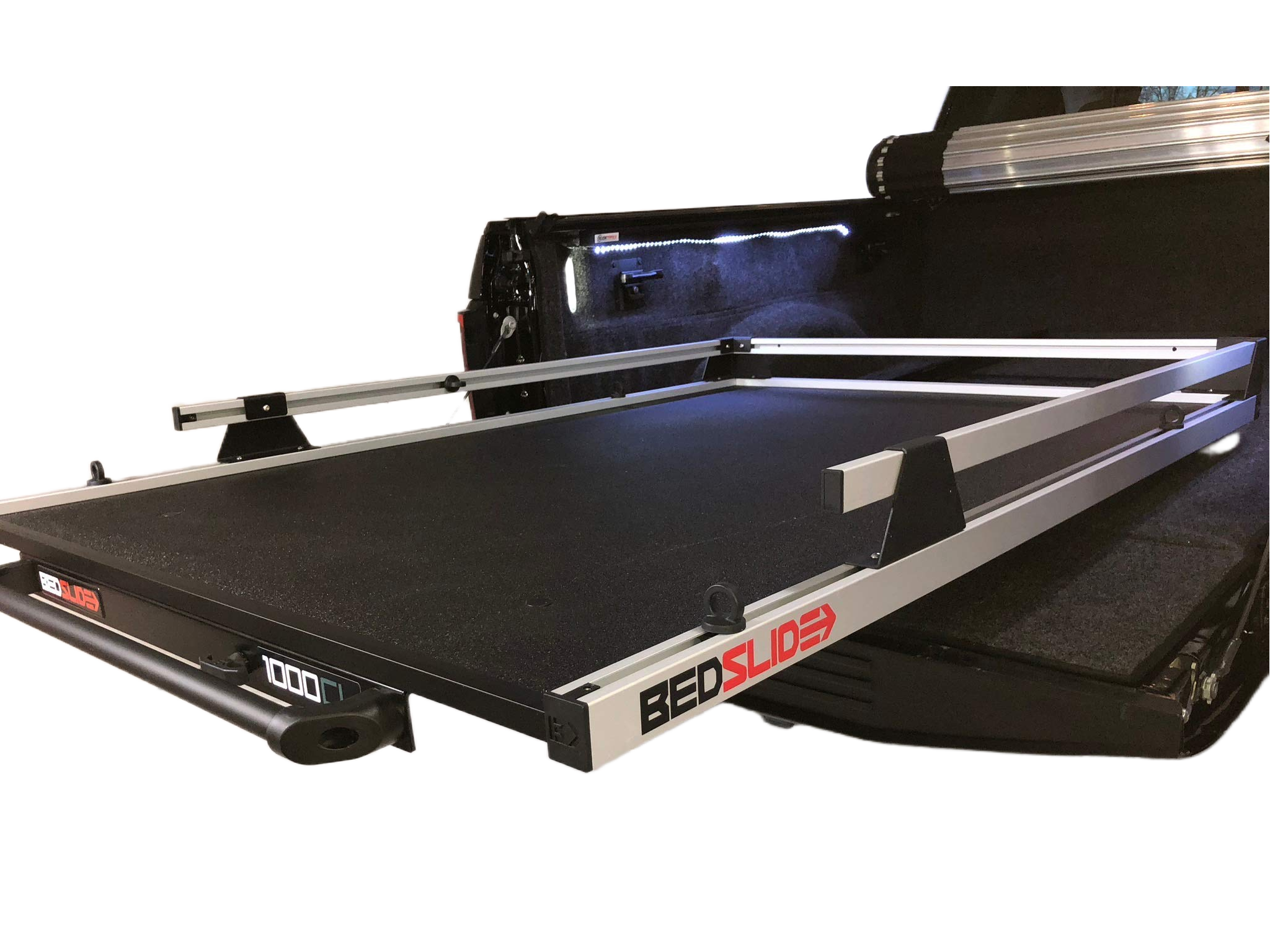 Black BEDSLIDE truck bed sliding platform with aluminum rails extended from a pickup bed