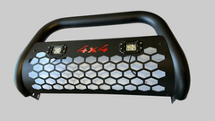 Black LED round bull bar with honeycomb grille and two square lights on a light neutral background