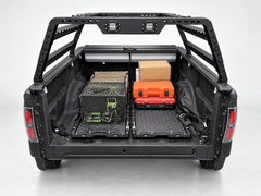 IRONHAUL two-piece slide-out truck bed cargo tray system secured inside a pickup bed