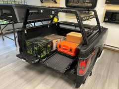 IRONHAUL slide-out truck bed cargo trays shown in a real pickup installation from a side angle