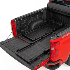 IRONHAUL two-piece slide-out truck bed cargo tray system installed in a pickup bed