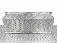 Close-up of matching aluminum wheel well cover and raised tread plate floor finish