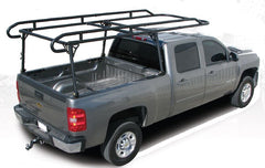 Black TrailFX heavy duty contractor ladder rack installed on a gray pickup truck